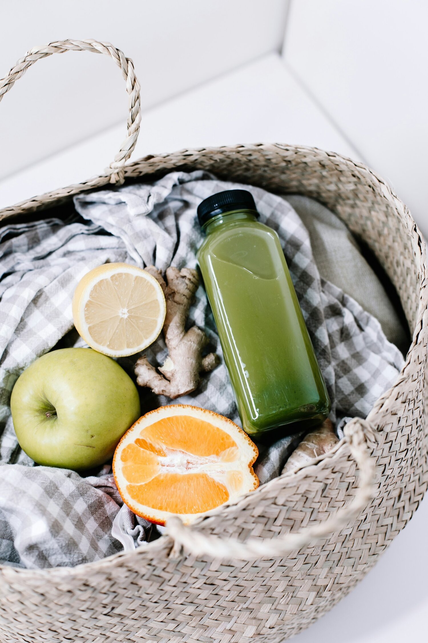 smoothie in a bottle, next to fruits