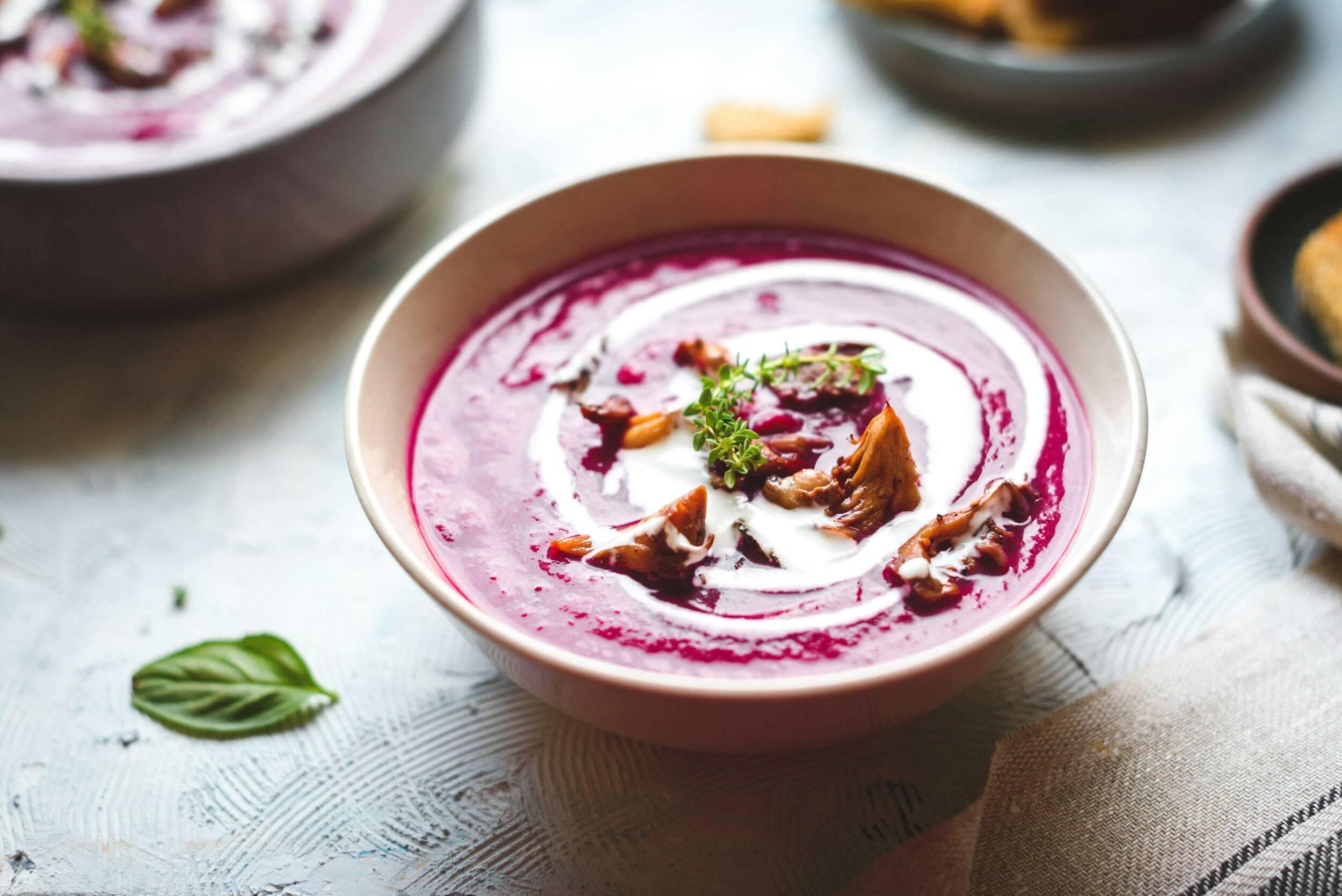 purple soup in a white bowl