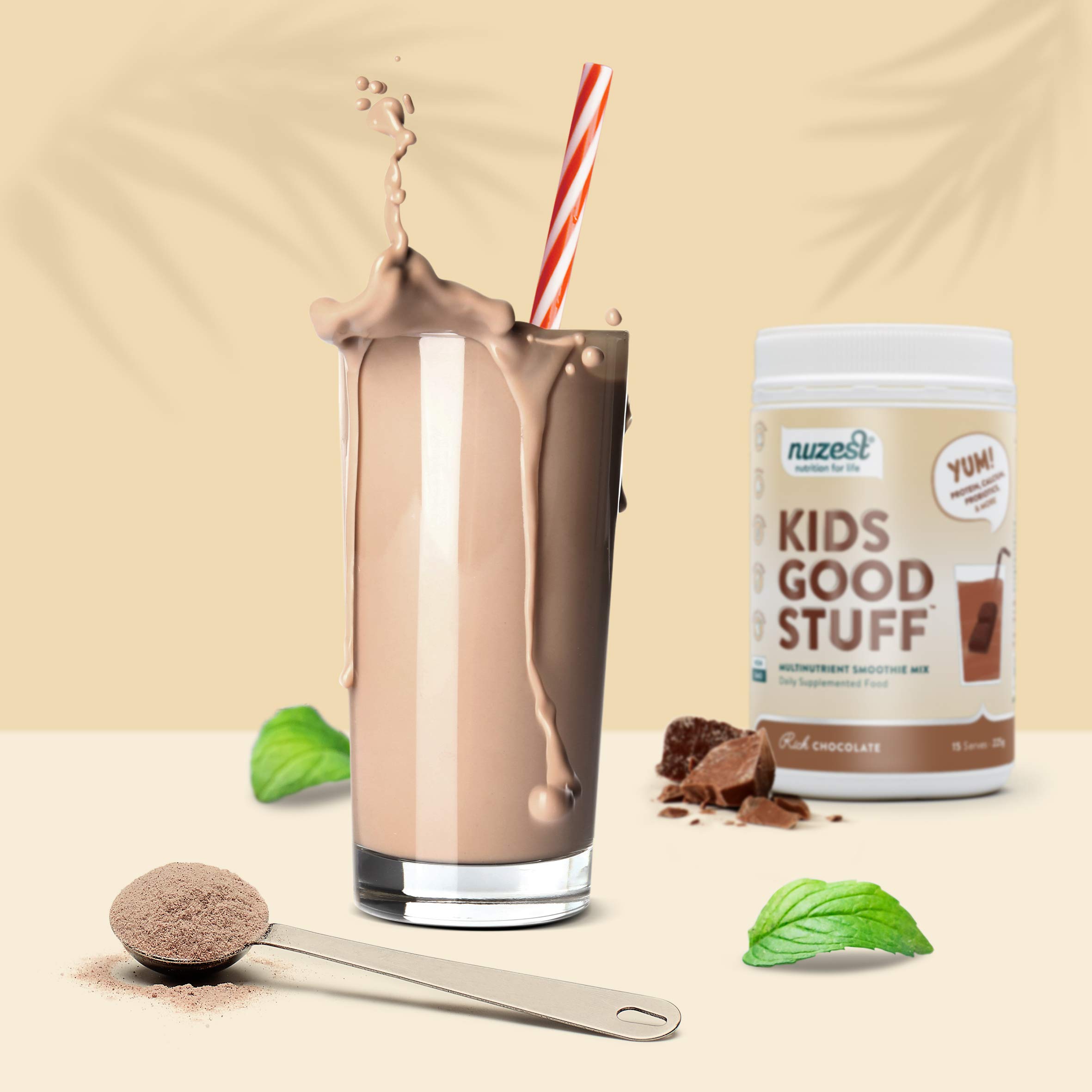 Chocolate smoothie in front of a container of Nuzest Kids Good Stuff