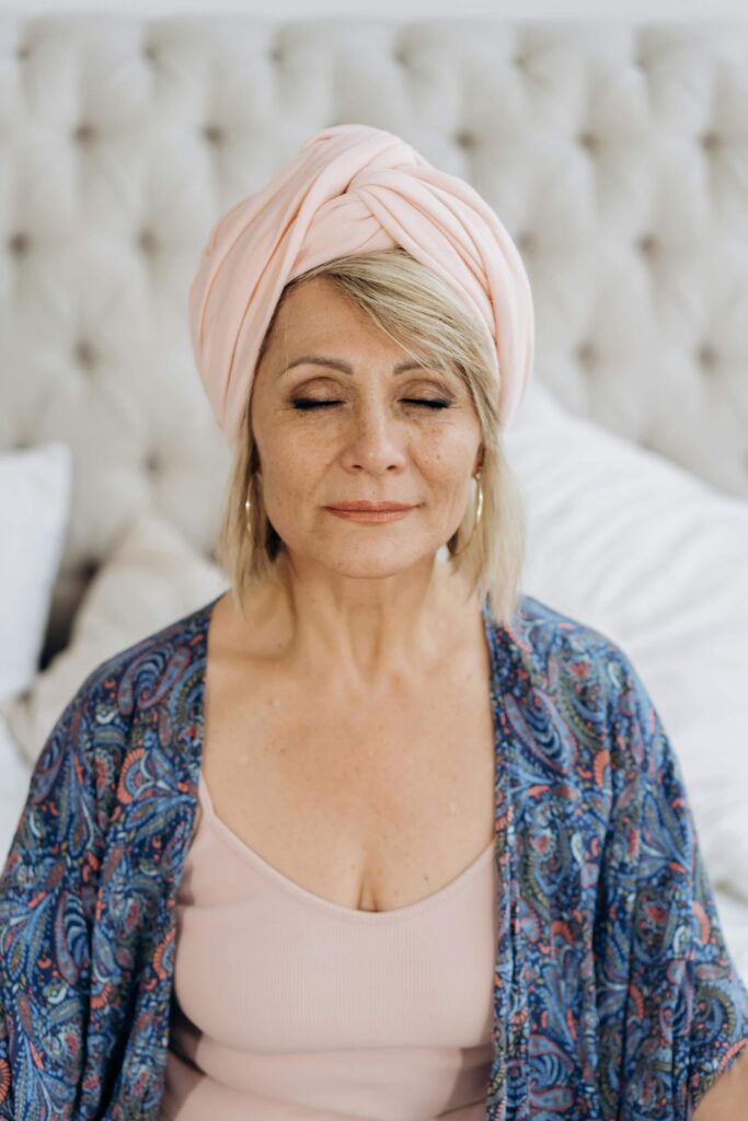 a middle aged woman meditating