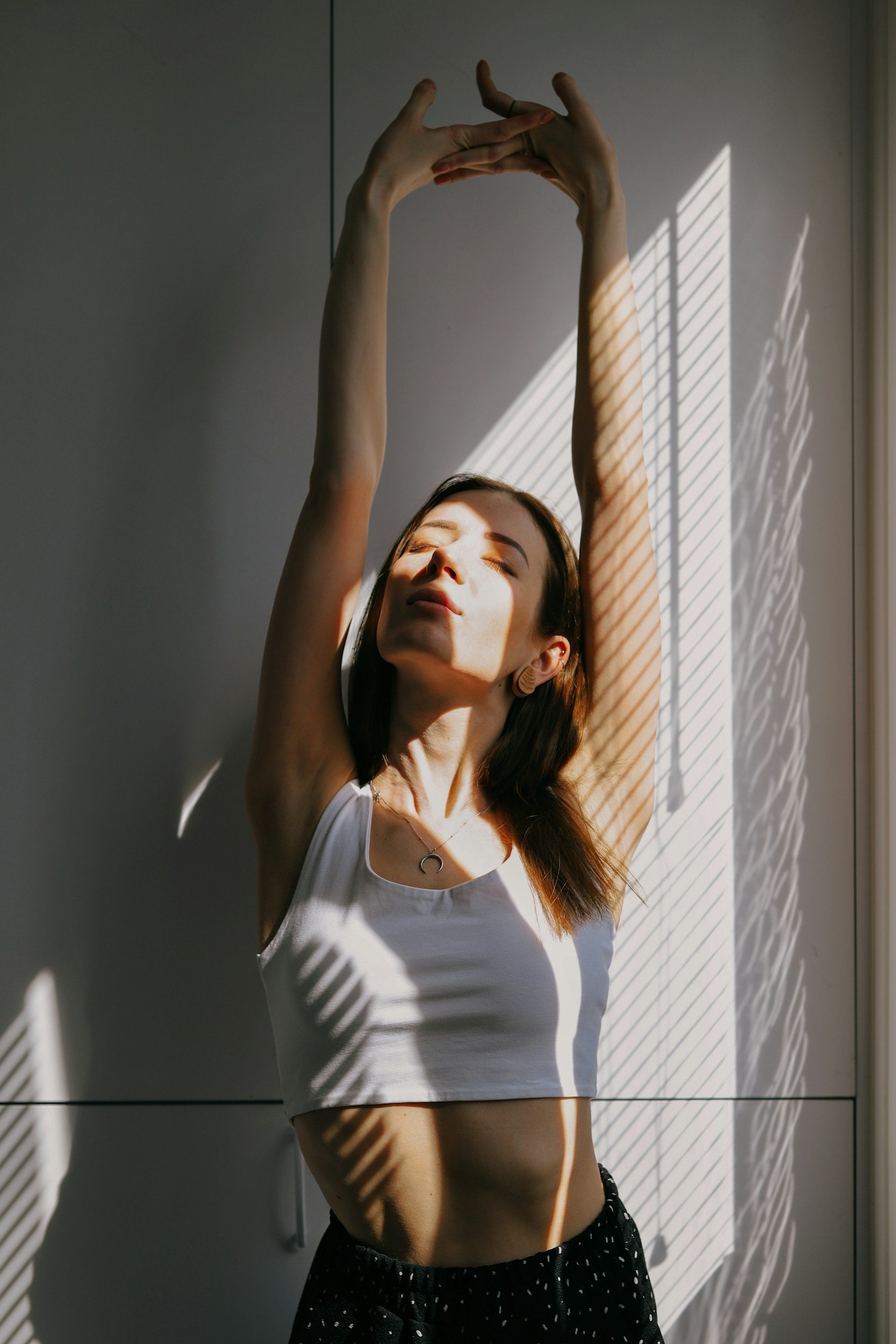 a woman stretching her arms