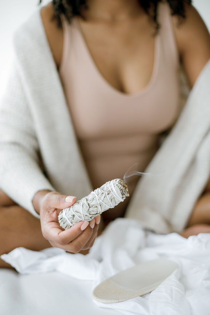 a woman smudging