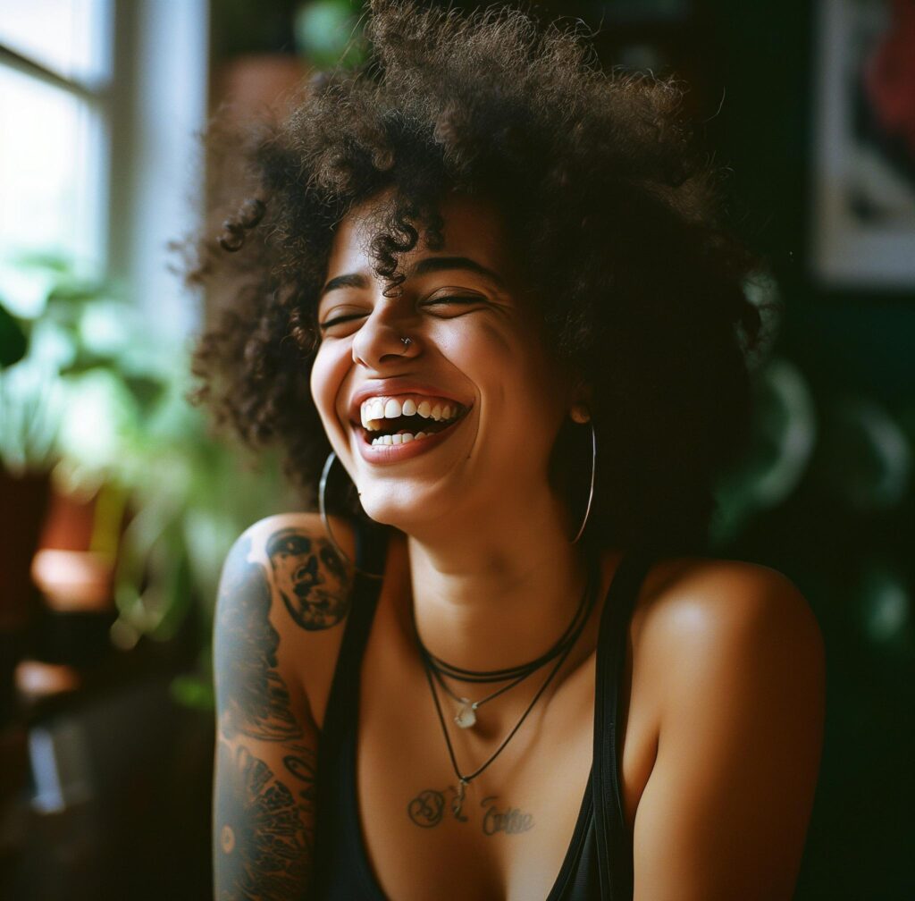 curly haired woman laughing