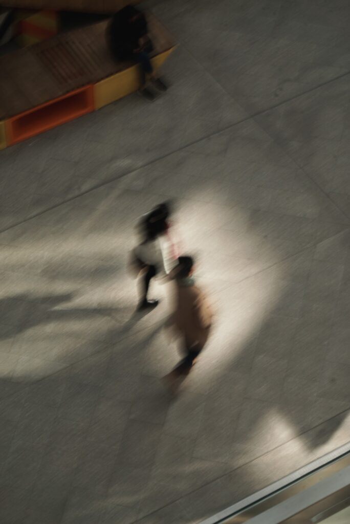 Motion - Person jogging on concrete parking garage floor