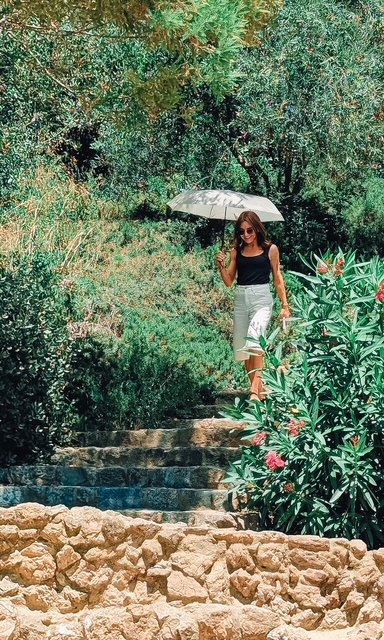 Park Güell in July heat — the umbrella doing the real work that day.