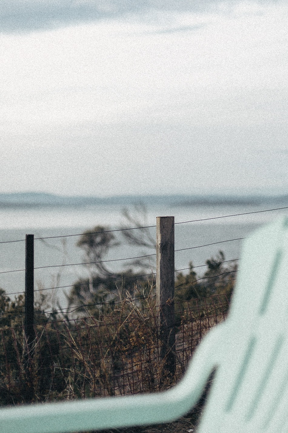 Subtle-Moments-Rustic-fence-overlooking-misty-coastal-landscape-and-water
