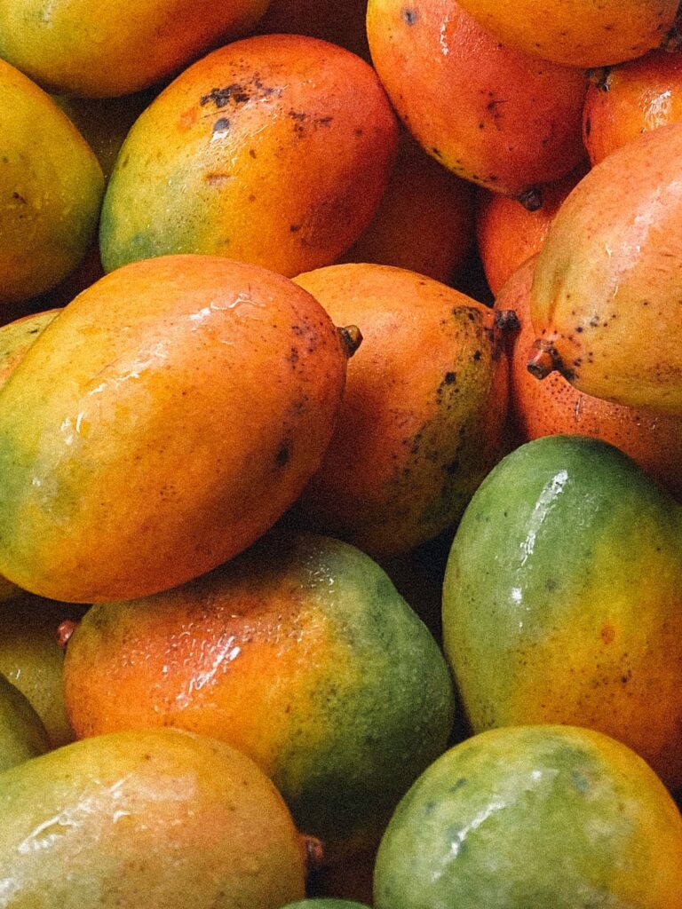 Dusk and Dawn - Vibrant assortment of fresh mangoes in warm golden tones - TVS