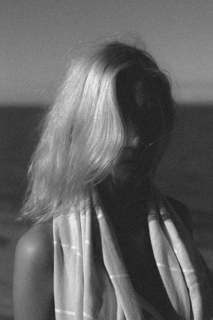 Dusk and Dawn - Woman with long blonde hair viewed from behind - TVS