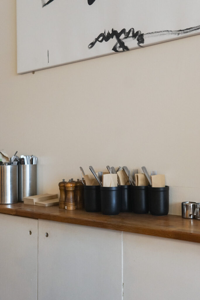 Minimalist kitchen shelf with organised utensil storage